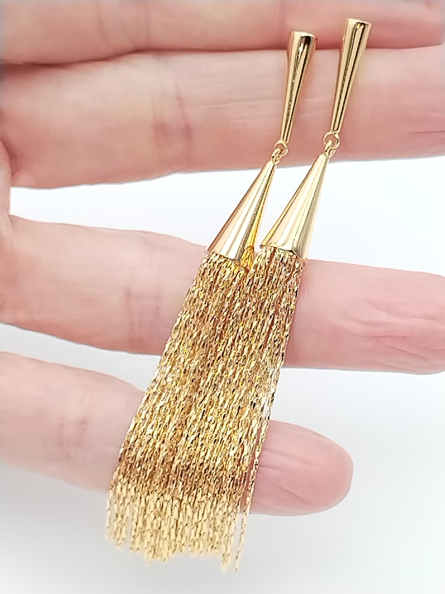 Elegant gold tassel earrings with conic chain design