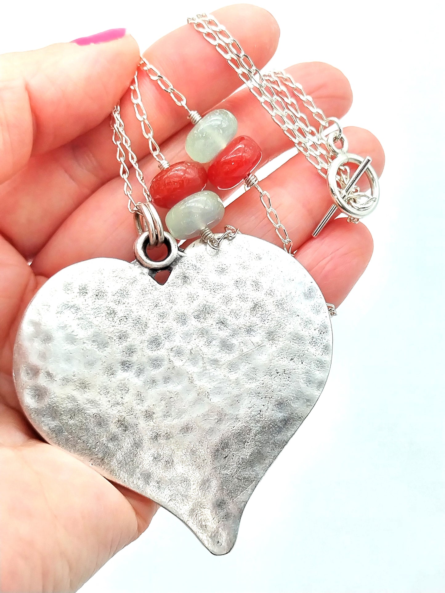 Sterling silver heart necklace with chalcedony gemstone product photography