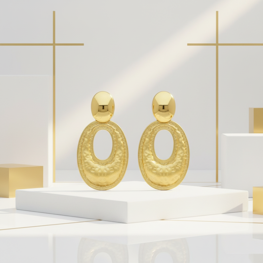 18k PVD gold hammered oval drop earrings displayed in elegant white and gold setting
