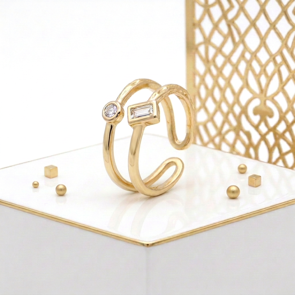 Textured gold plated ring showing the open back and two bands with bezel set cubic zirconia