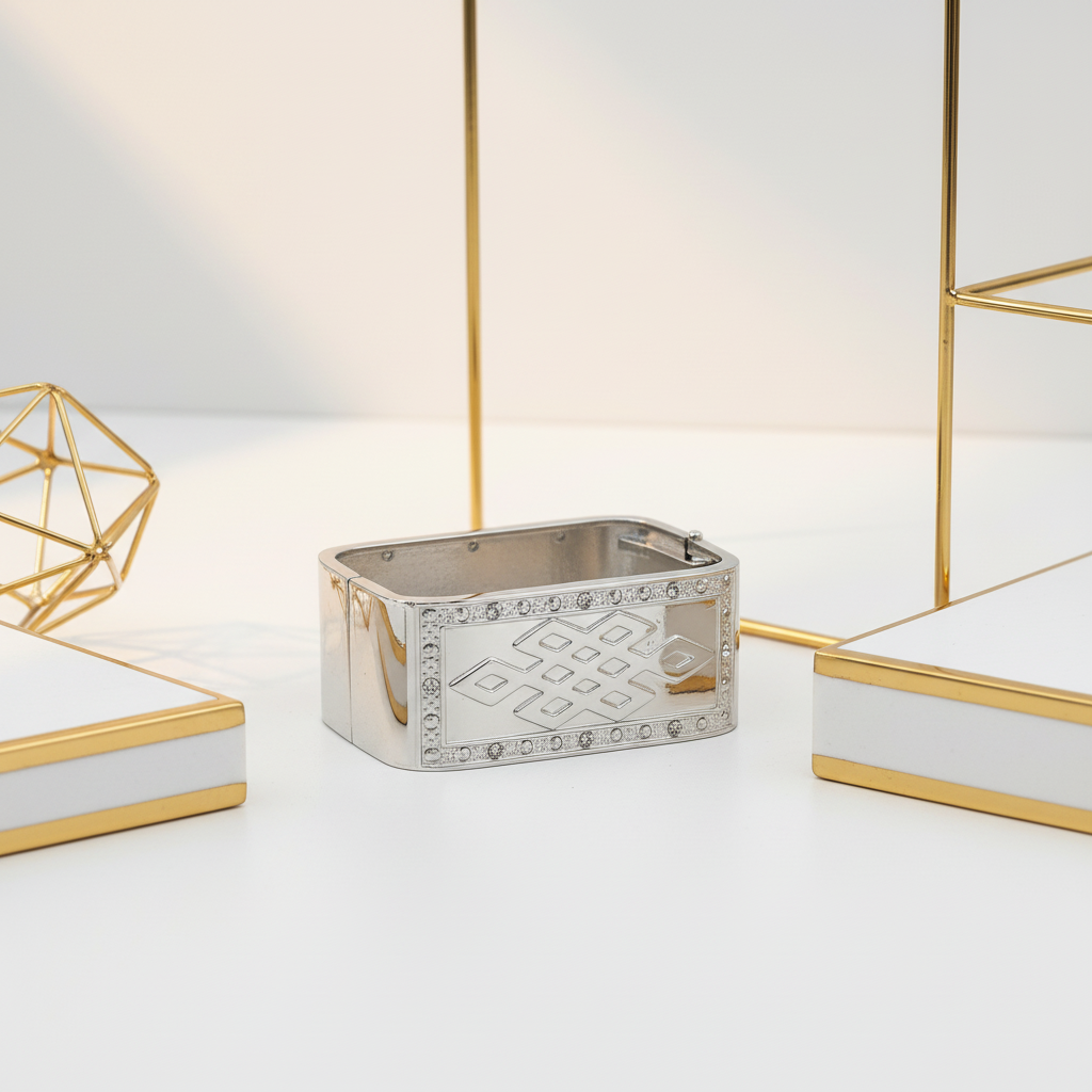 Shiny silver rectangular bangle displayed in elegant white and gold setting - luxury statement jewelry