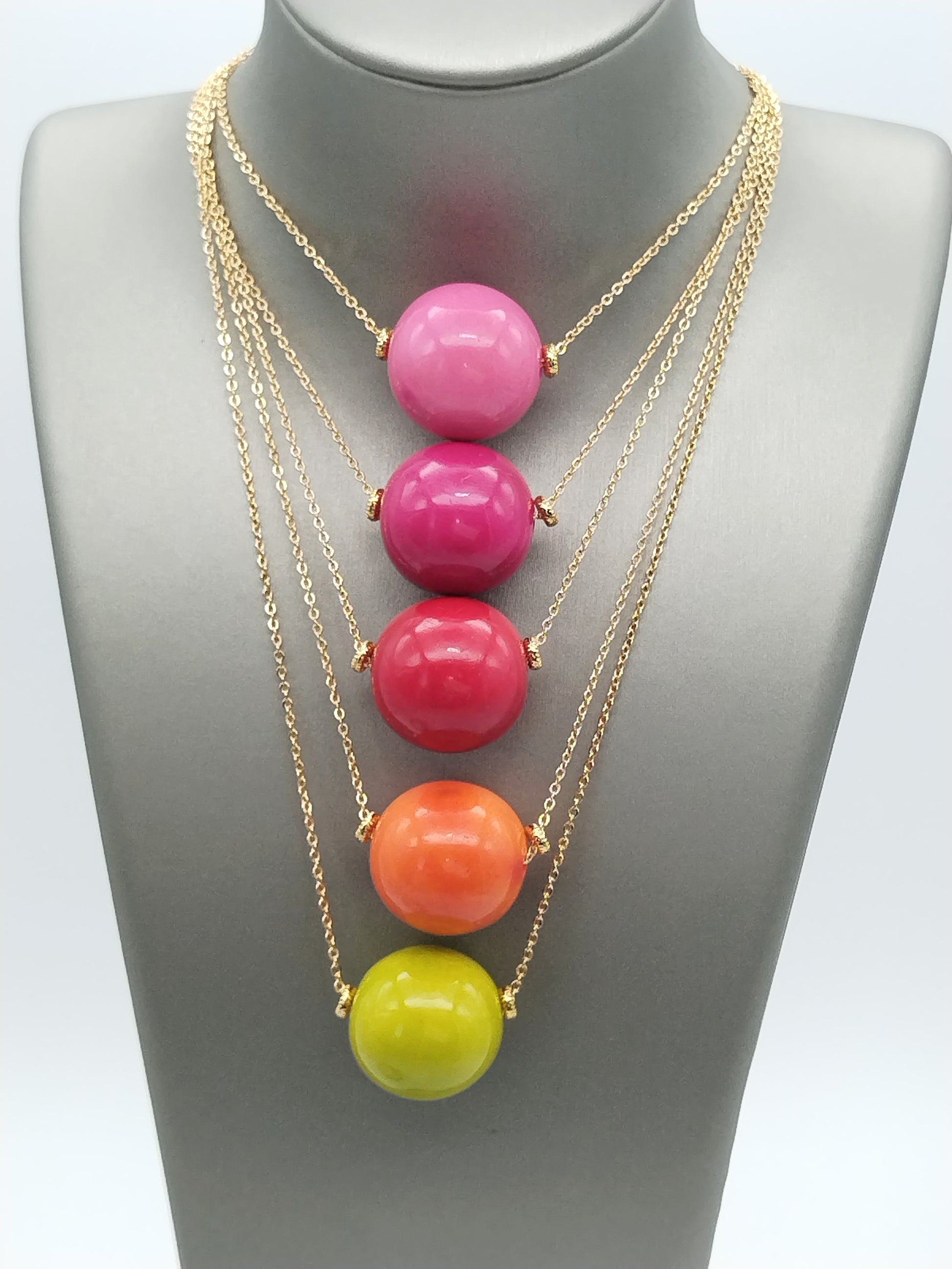 Sustainable red tagua nut pendant - vegan alternative to ivory on gold necklace