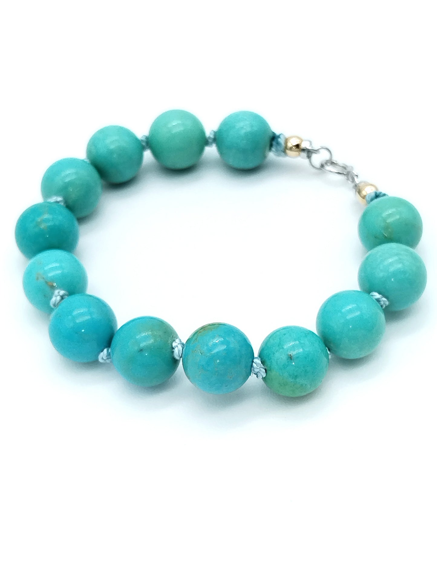 Large Campitos turquoise beaded bracelet with 14k white gold knot clasp on white background