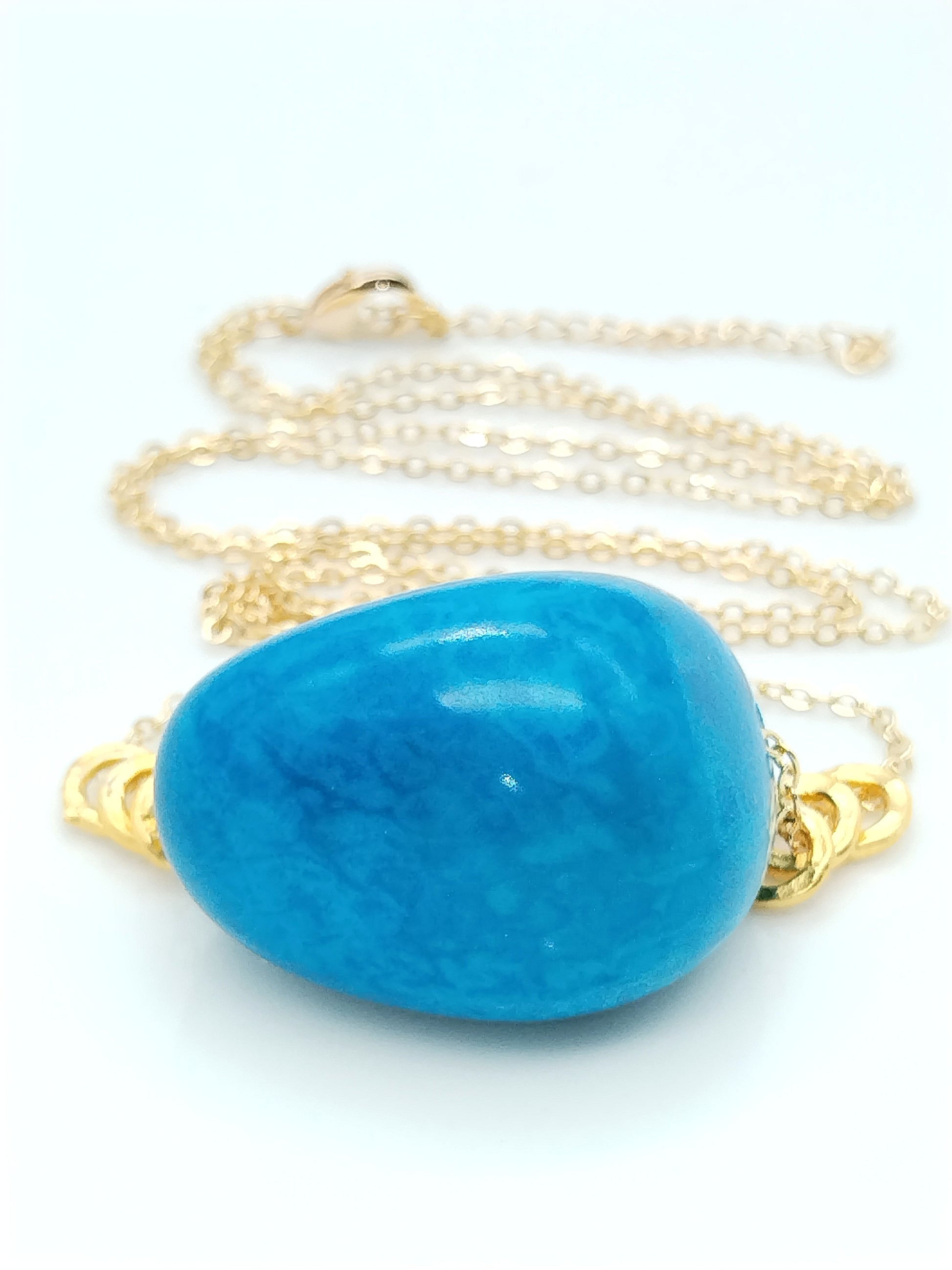 Blue tagua seed pendant on gold chain - boho sustainable jewelry