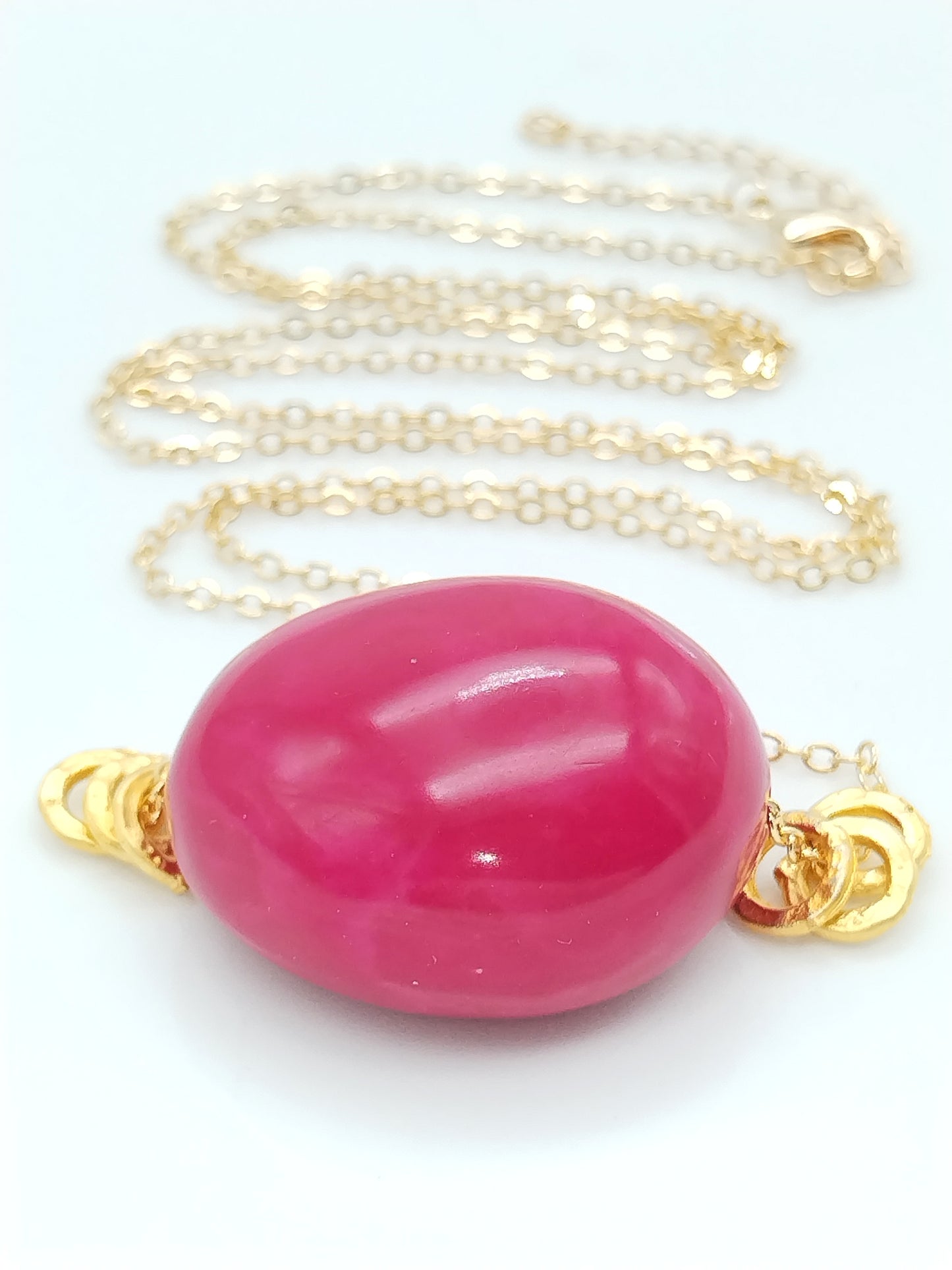 Fuchsia pink tagua seed necklace - gold plated chain close-up