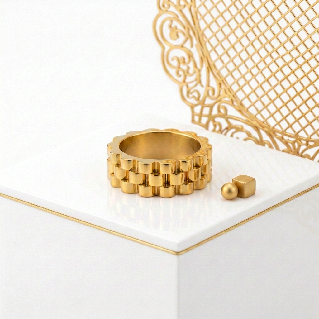 Wide stainless steel ring with 18k PVD Gold coating and watch band texture
