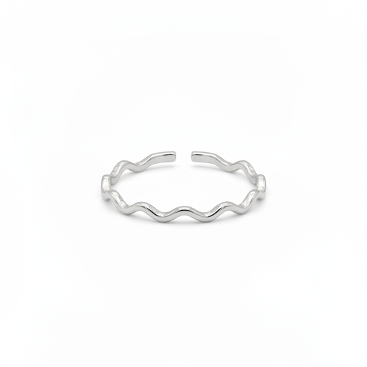 Rhodium plated wave ring with a delicate band and adjustable open back on a white background