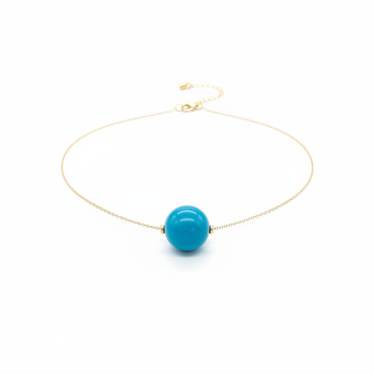 Turquoise tagua bead necklace with 18k gold plated chain on white background - sustainable vegetable ivory jewelry