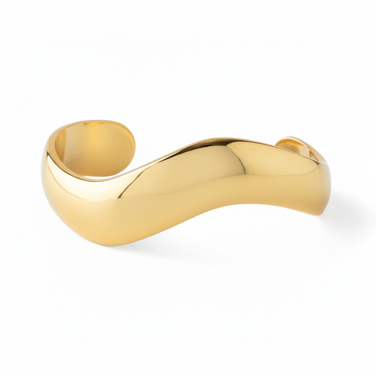 Bold wavy gold cuff bracelet 18k PVD stainless steel on white background
