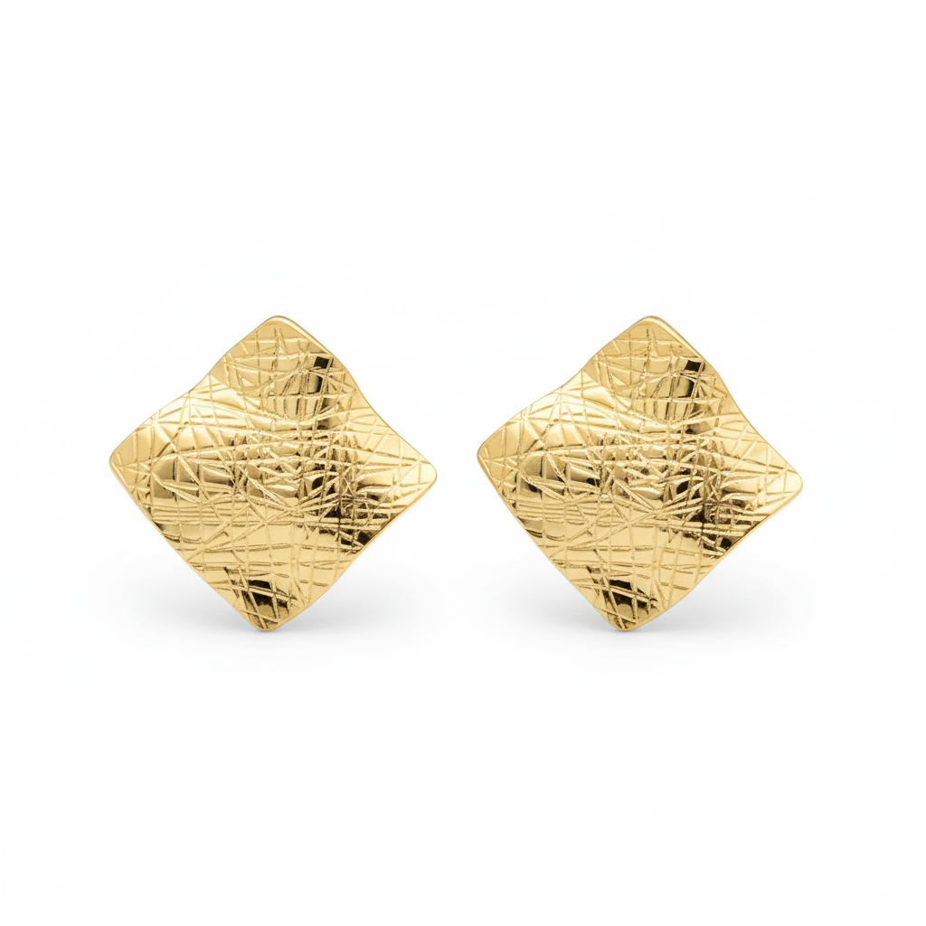 Close-up of chunky wavy gold stud earrings with geometric diamond silhouette on white background | Ms Friesch
