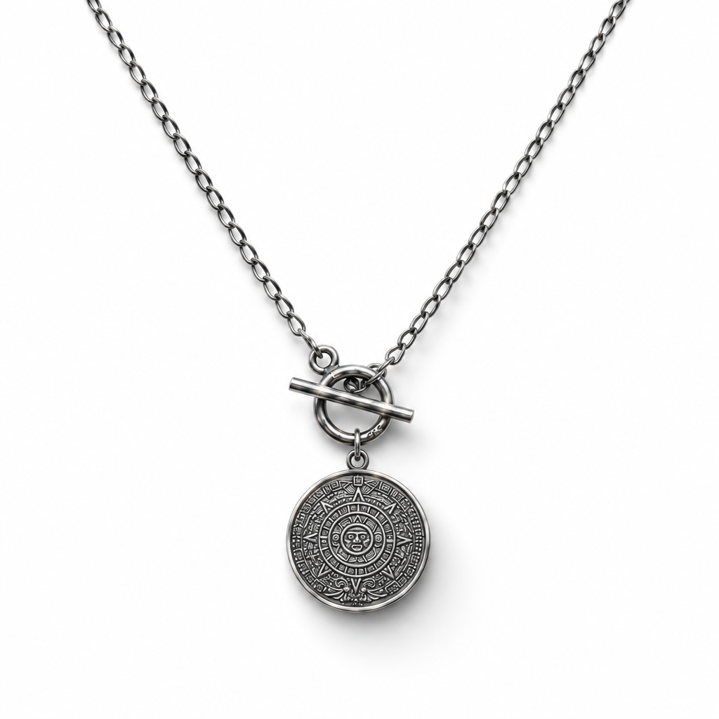 Sterling silver coin necklace with circular engraving and front toggle clasp on a white background