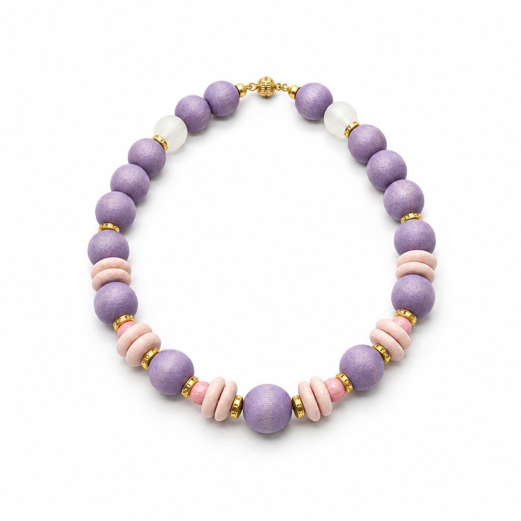 Lavender wood bead necklace with blush pink discs, African glass beads and gold-tone accents on a white background