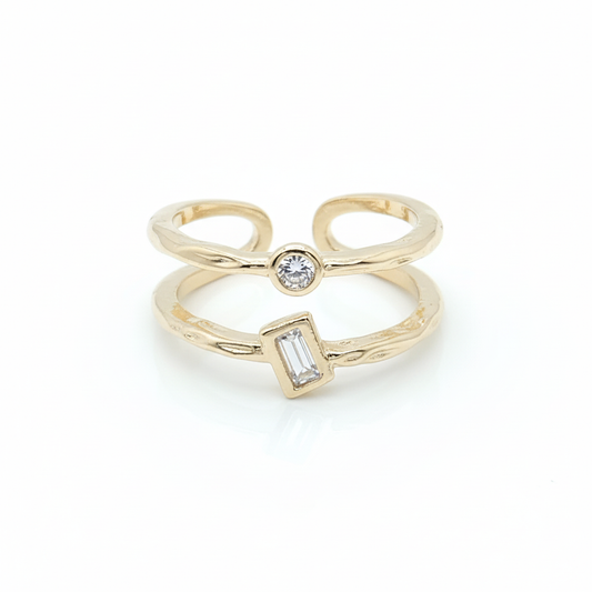 Double band gold plated ring with round and baguette CZ stones showing adjustable open back on white background