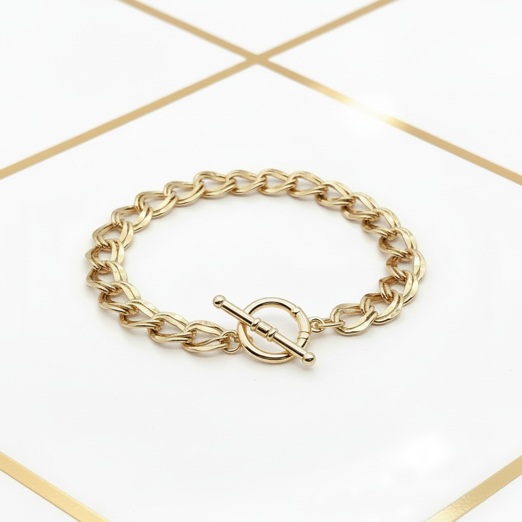 18k gold plated curb chain bracelet toggle clasp detail, white and gold editorial | Ms Friesch
