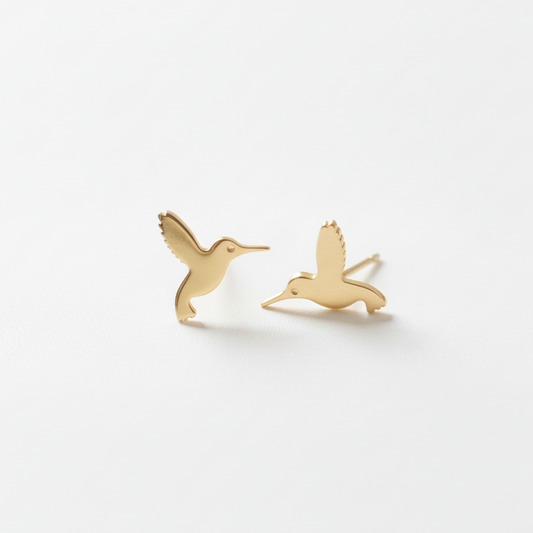 Gold plated hummingbird stud earrings 10mm small bird earrings white background jewelry photography
