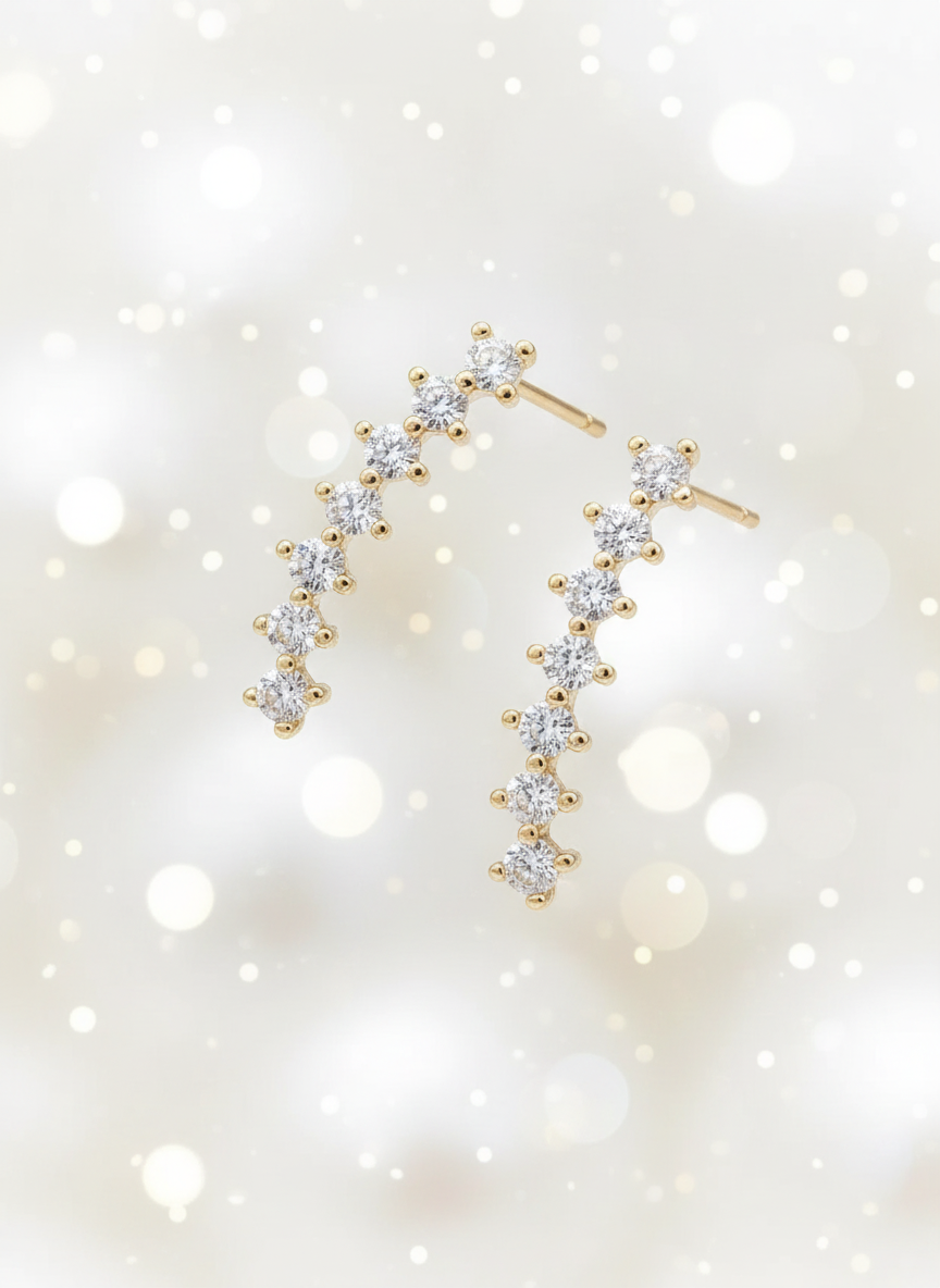 Gold plated helix piercing earrings with CZ stones on white background - minimalist cartilage studs by Ms Friesch