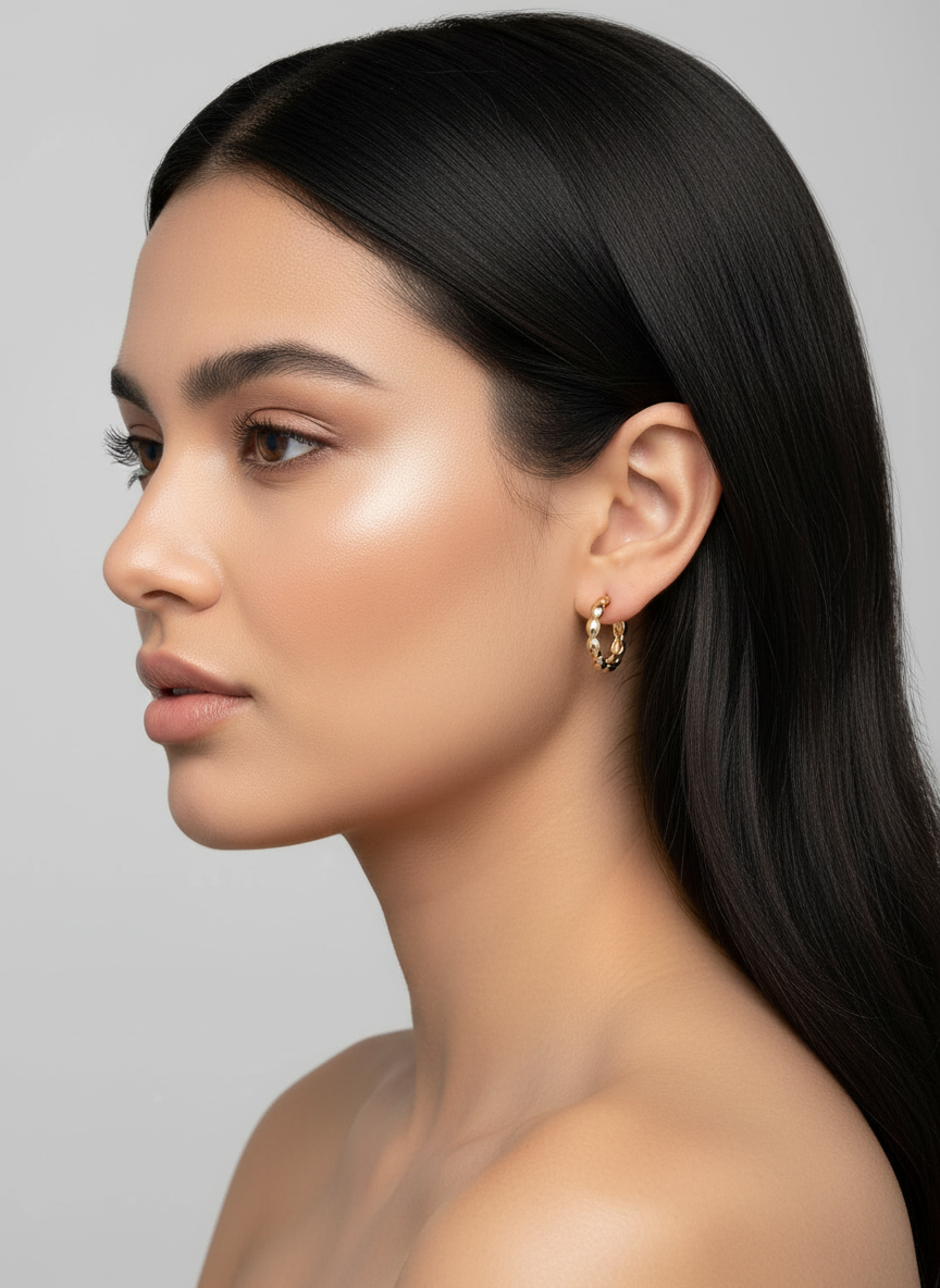 18k gold plated huggie hoop earrings worn by model with black hair - minimalist jewelry - 16mm diameter