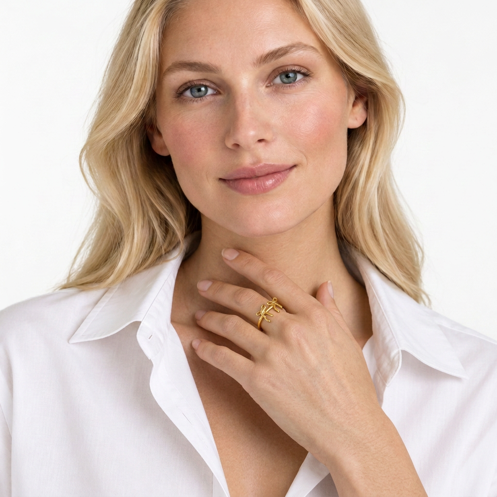 Delicate twin ribbon bow ring worn on the finger