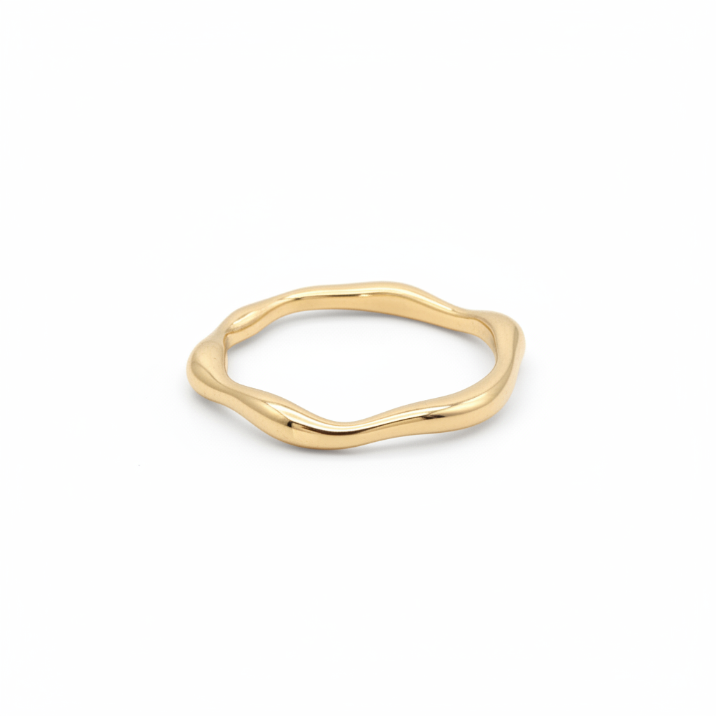 Irregular wavy band ring in 18k gold plating on white background - minimalist sculptural design