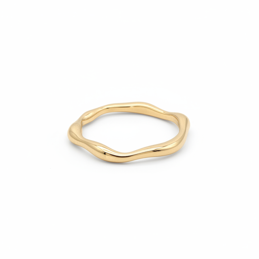 Irregular wavy band ring in 18k gold plating on white background - minimalist sculptural design