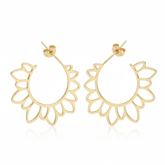 Large gold hoop earrings on clean white background