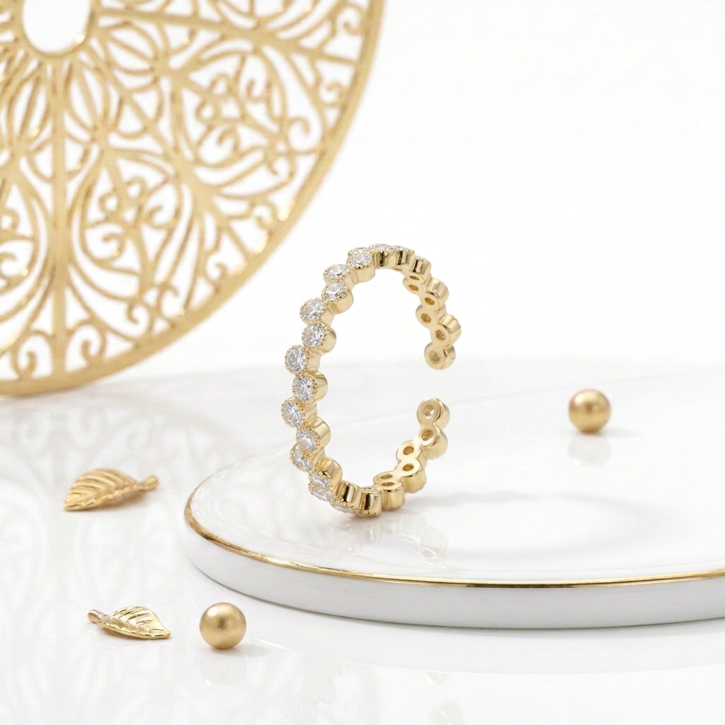 Gold plated cubic zirconia zigzag ring standing on a white podium with a fine gold edge