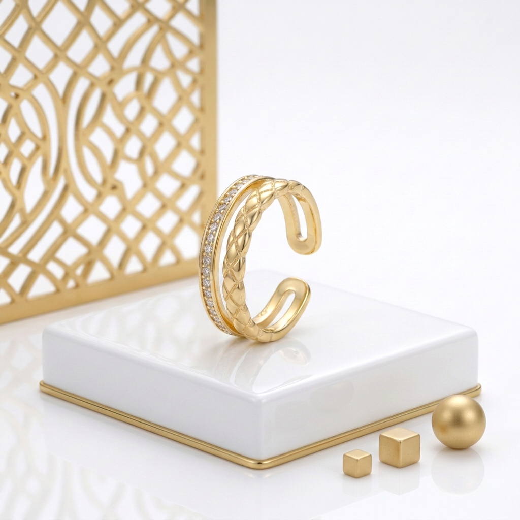 Open back 18k Gold Plated ring with a textured braid and cubic zirconia band