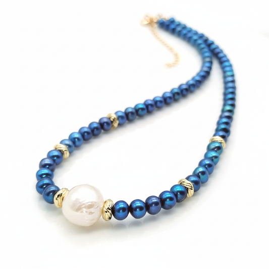 Navy blue pearl necklace with 14k gold filled accents and Edison focal pearl on white background