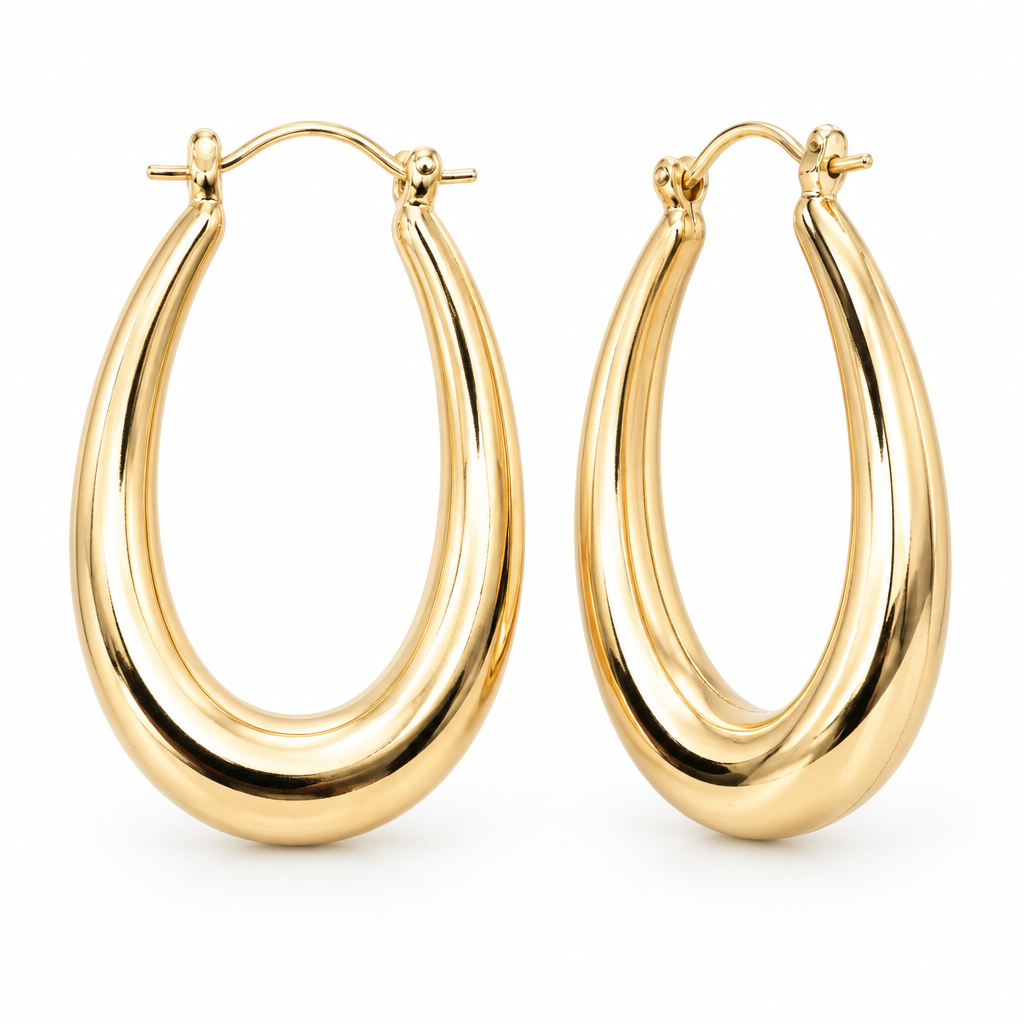 Pair of polished oval hoop earrings in 18k Gold Plated with hinged closures on a white background