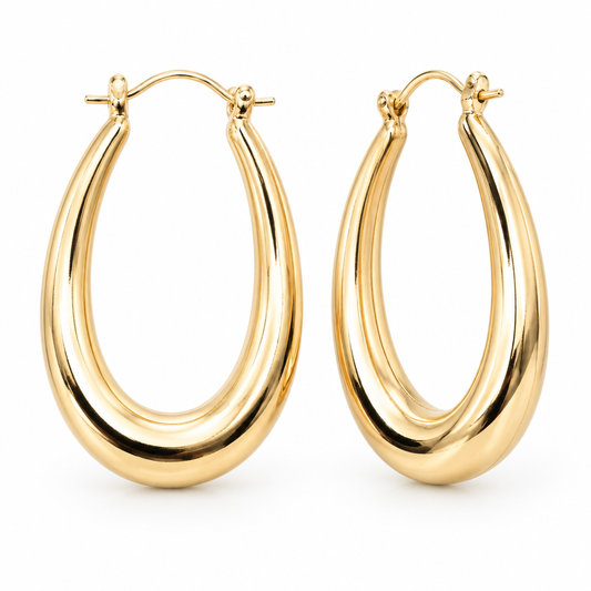 Pair of polished oval hoop earrings in 18k Gold Plated with hinged closures on a white background