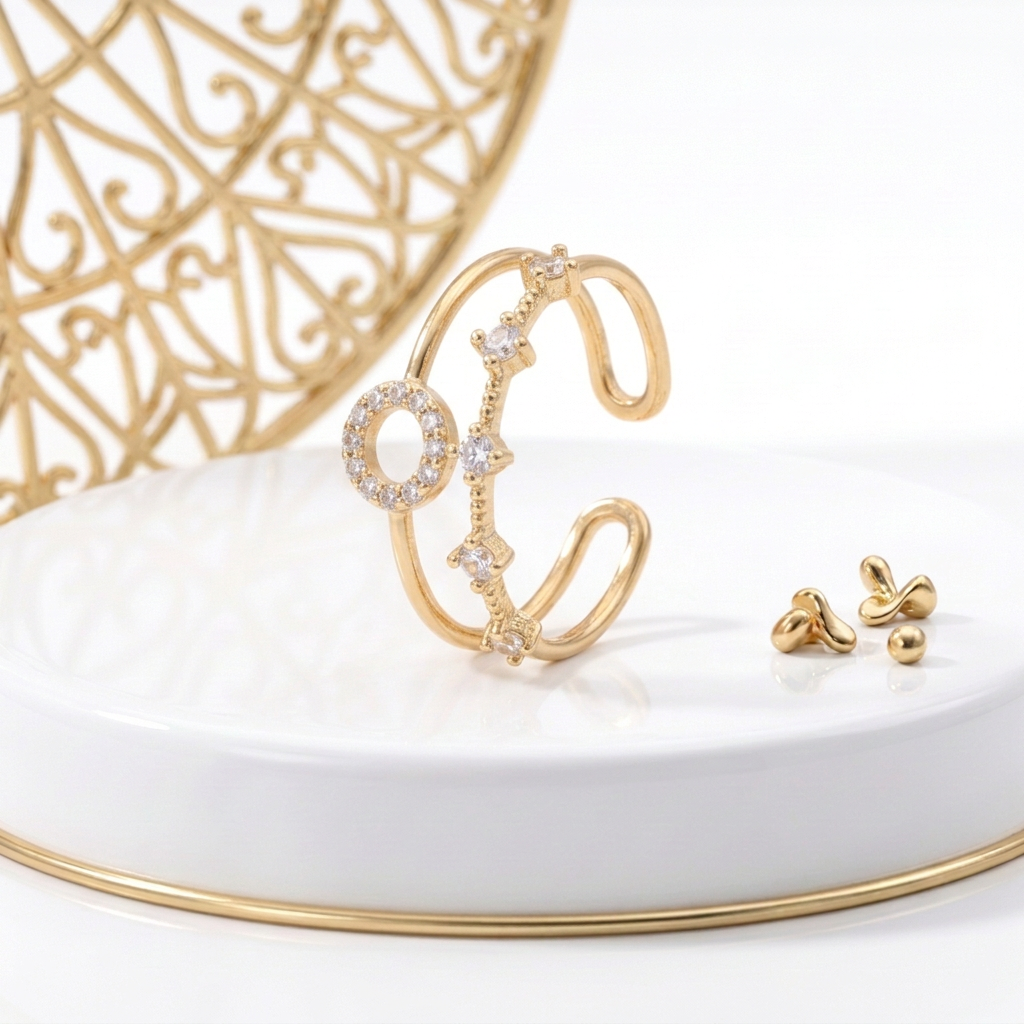 18k Gold Plated double band CZ ring standing on a white pedestal with gold trim and an ornate gold lattice behind
