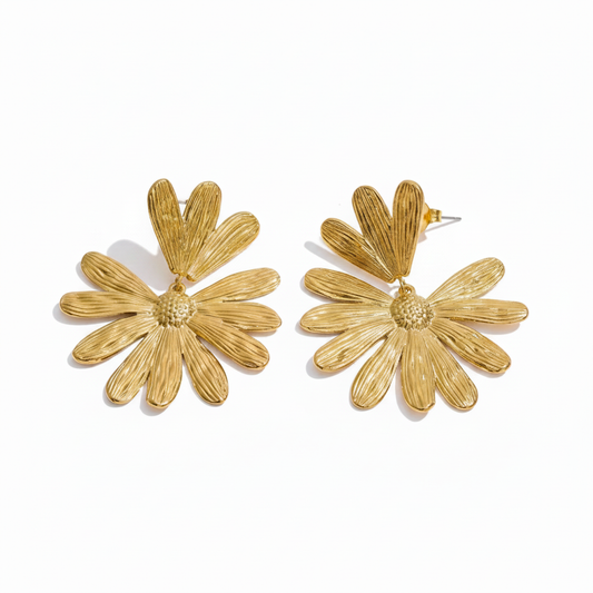 Oversized flower stud earrings in 18k PVD gold stainless steel on white background
