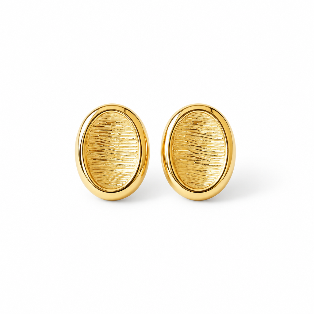 Oval button stud earrings in 18k PVD Gold with textured centres and polished rims on a pure white background