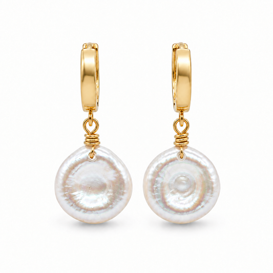 Natural keshi pearl hoop earrings with hand wrapped 14K gold filled wire on a white background