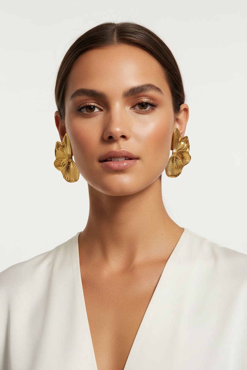 Woman wearing chunky gold petal flower stud earrings, 18k PVD gold, waterproof tarnish-resistant | Ms Friesch
