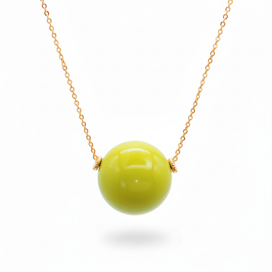 Pistachio green tagua bead necklace with 18k gold plated chain on white background