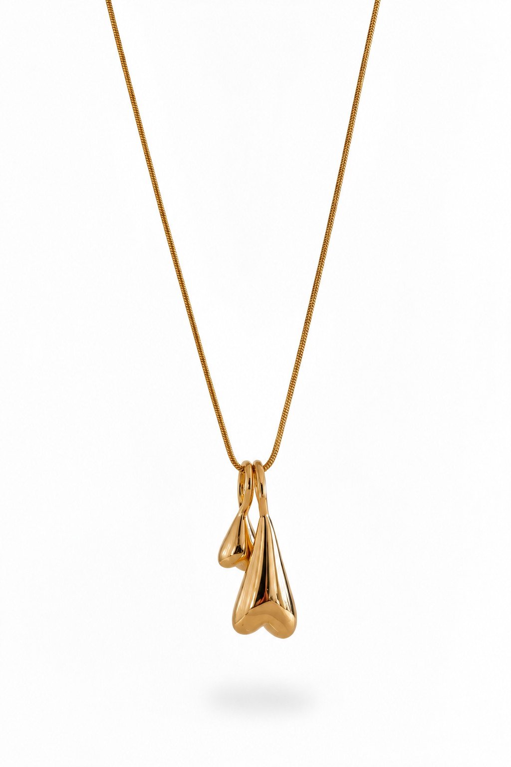 Two elongated inverted heart pendants on an 18k PVD Gold necklace
