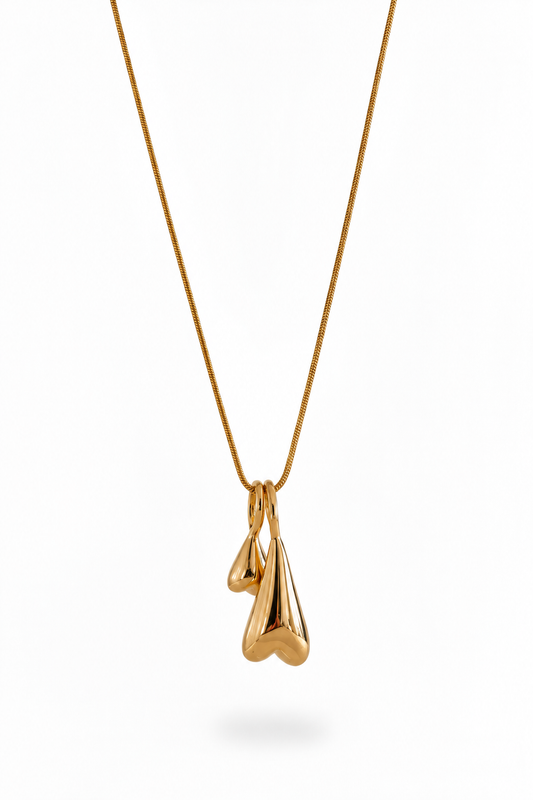 Two elongated inverted heart pendants on an 18k PVD Gold necklace
