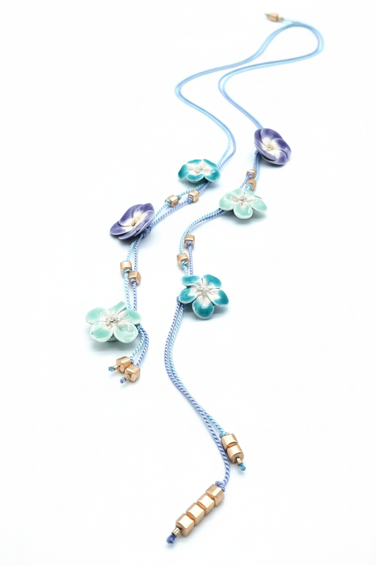 Handmade purple and turquoise ceramic flower open lariat necklace on white background - French artisan silk jewelry 84cm long