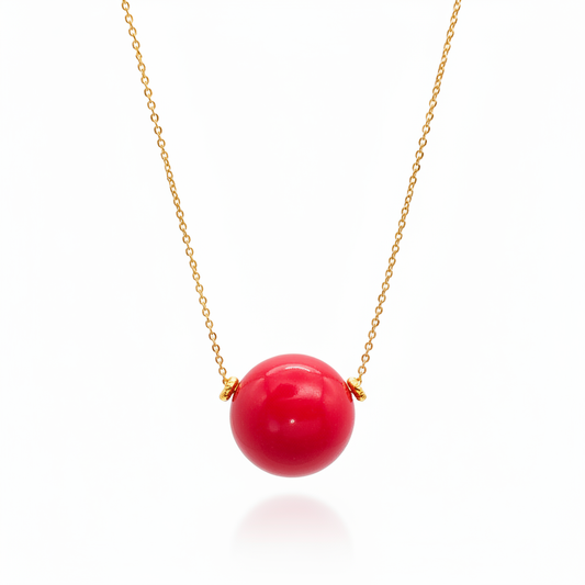 Red tagua bead necklace with 18k gold plated chain on white background