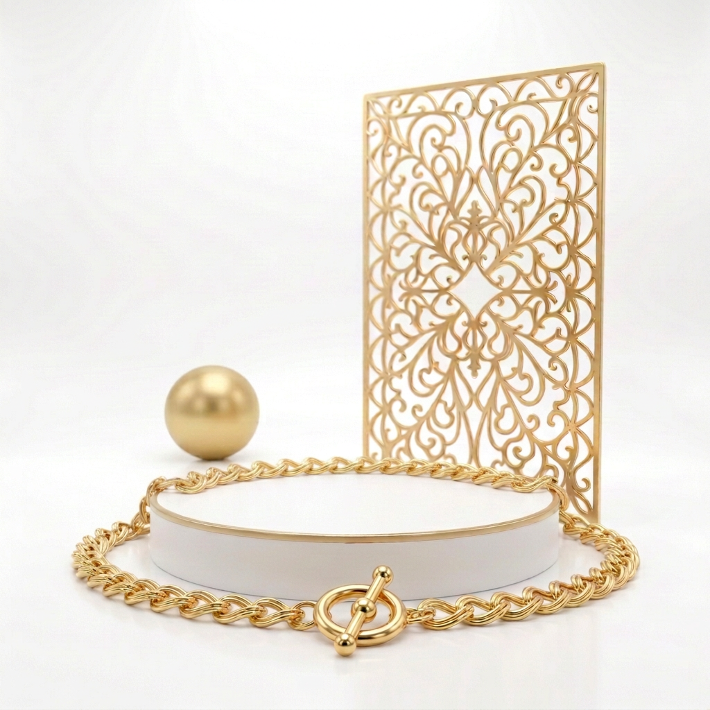 18k Gold Plated double link necklace arranged around a white pedestal with the toggle clasp in the foreground