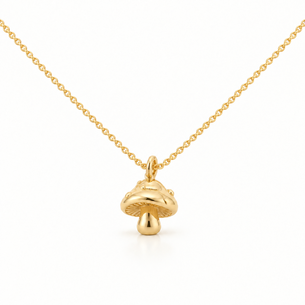 Tiny 3D mushroom charm necklace in 18k Gold Plated on a white background