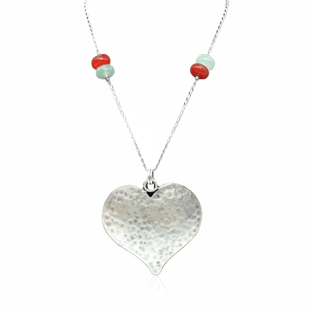 Silver heart necklace on clean white background
