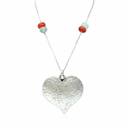 Silver heart necklace on clean white background