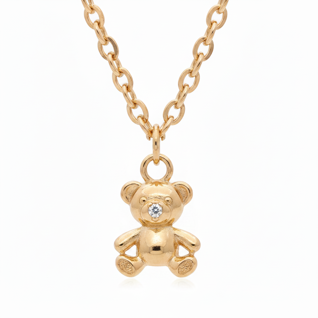 18k gold plated teddy bear charm pendant necklace with CZ nose detail on gold filled chain, white background

