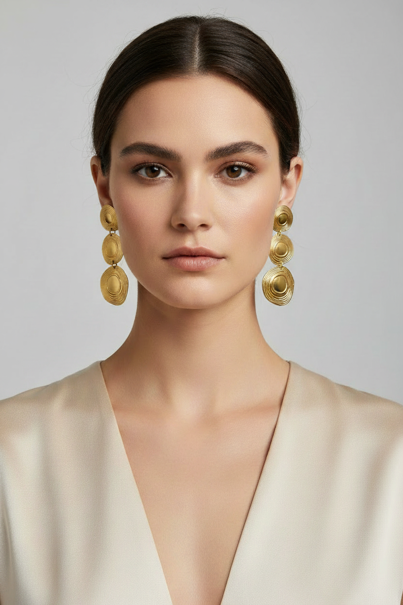 Woman wearing 18K Gold PVD Triple Disc Statement Dangle Earrings - Gold Drop Earrings
