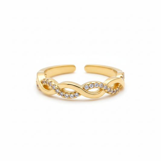 Twisted two band ring in 18k gold plating with CZ stones on white background - adjustable open design by Ms Friesch