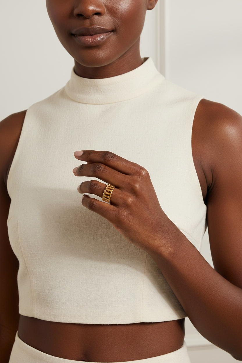 Model wearing wide oval geometric PVD gold ring – bold statement ring – Ms Friesch
